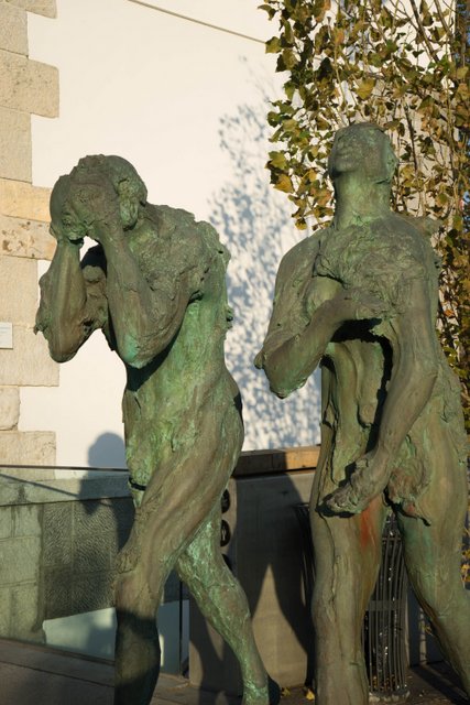 Adam and Eve expelled from Eden and walking towards Ljubjana Cathedral