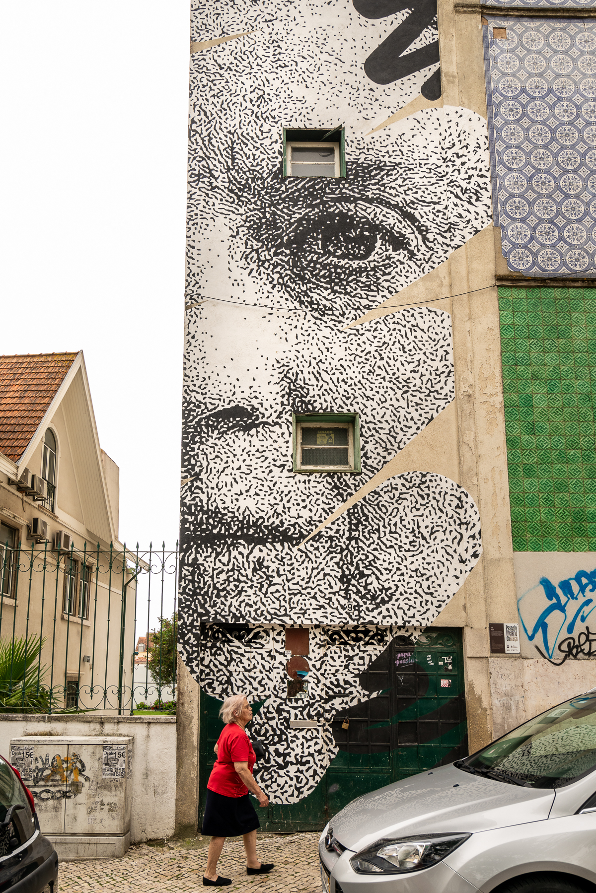 Stencilled black and white mural of the face of Sophia