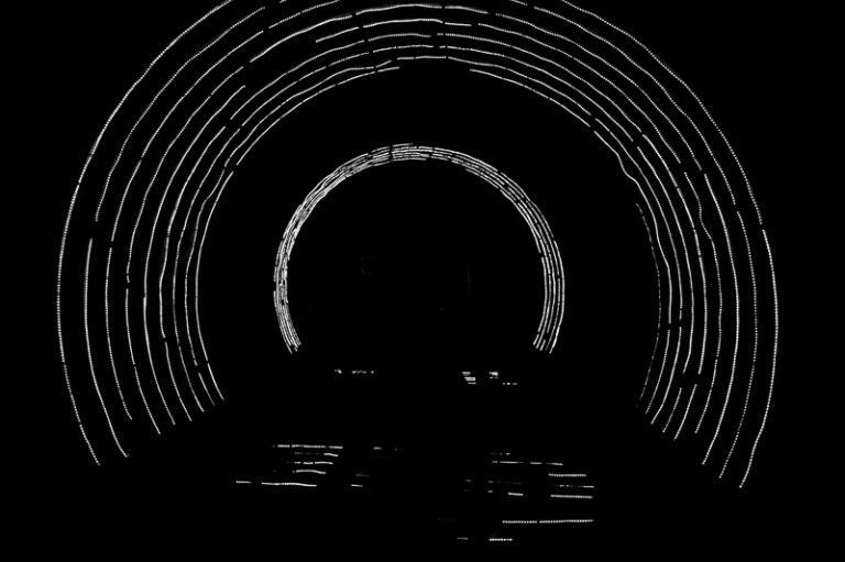 arcs of light around a train tunnel