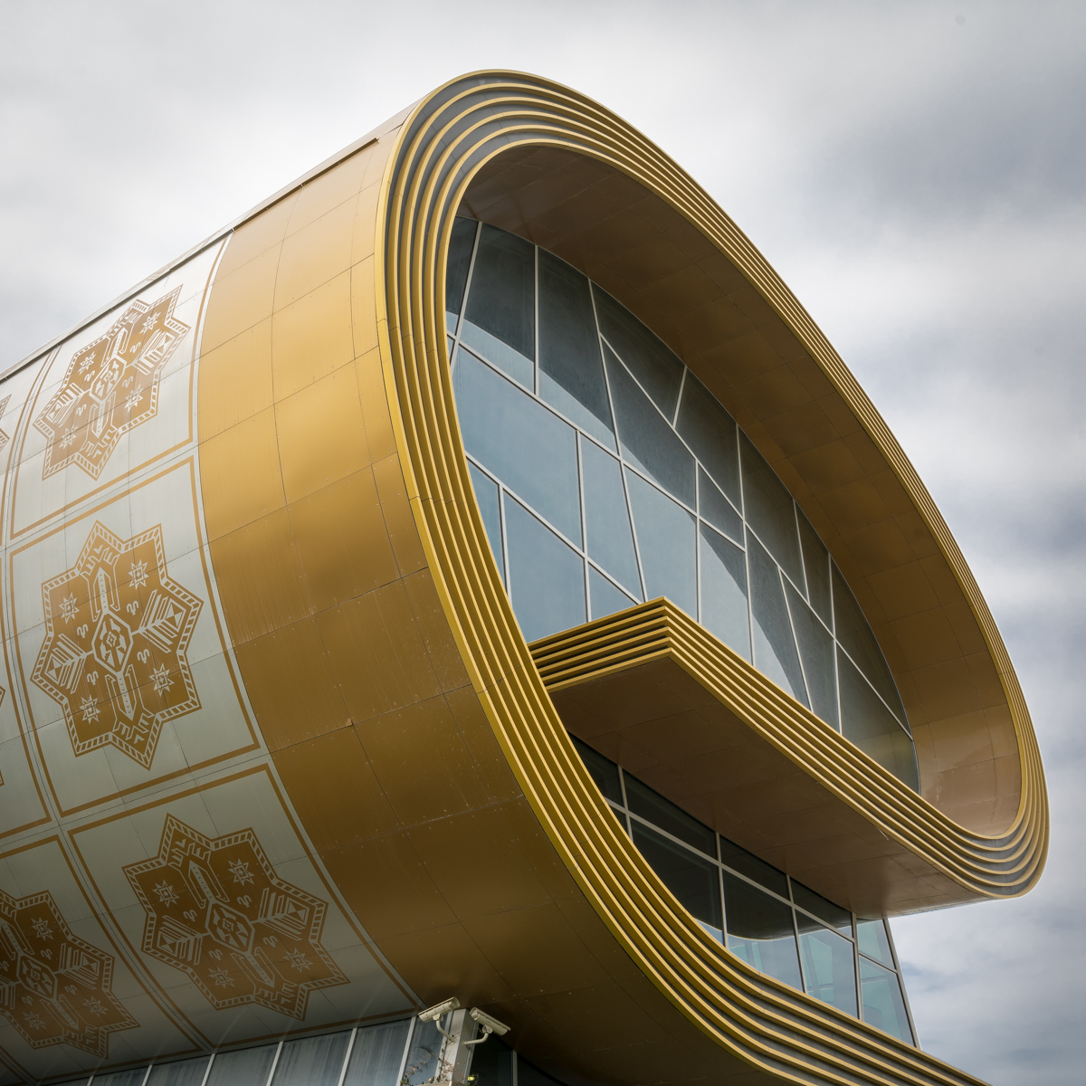 A building resembling a roll of carpet