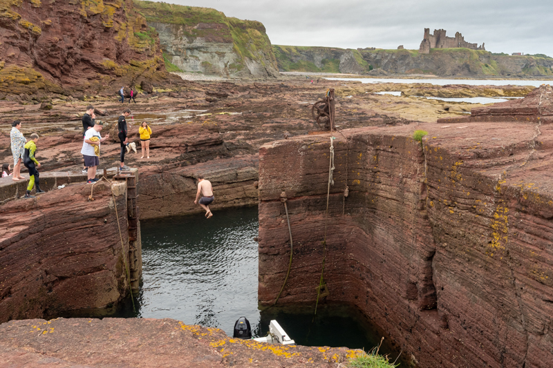 Someone jumping into Seacliff Harbour 