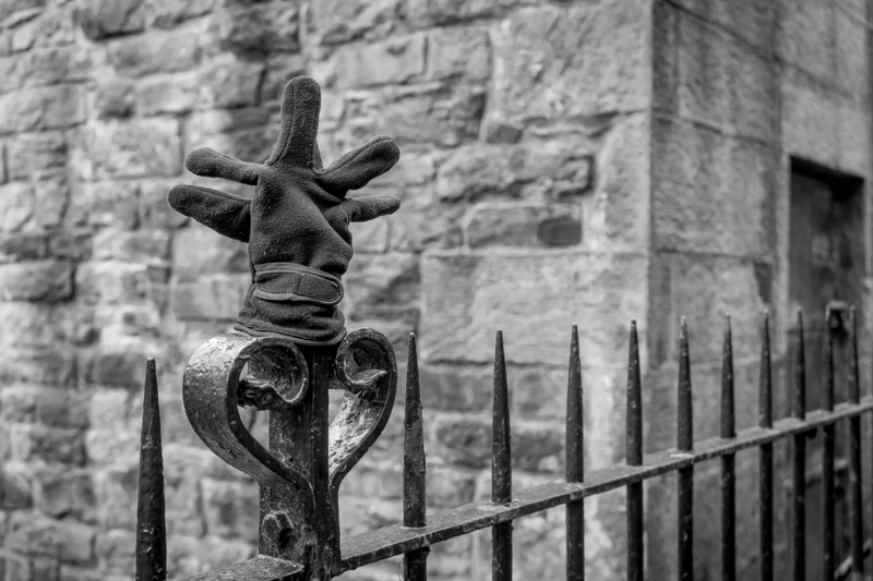 Lost glove on railings