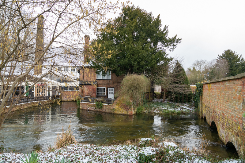 snow and rushing water at Kingsbury Watermill
