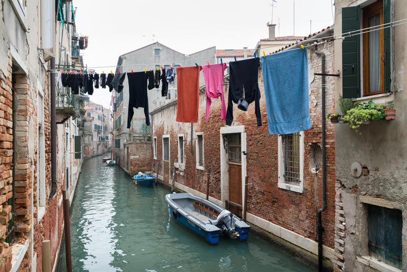 Washing hung out to dry above a canal in Venice