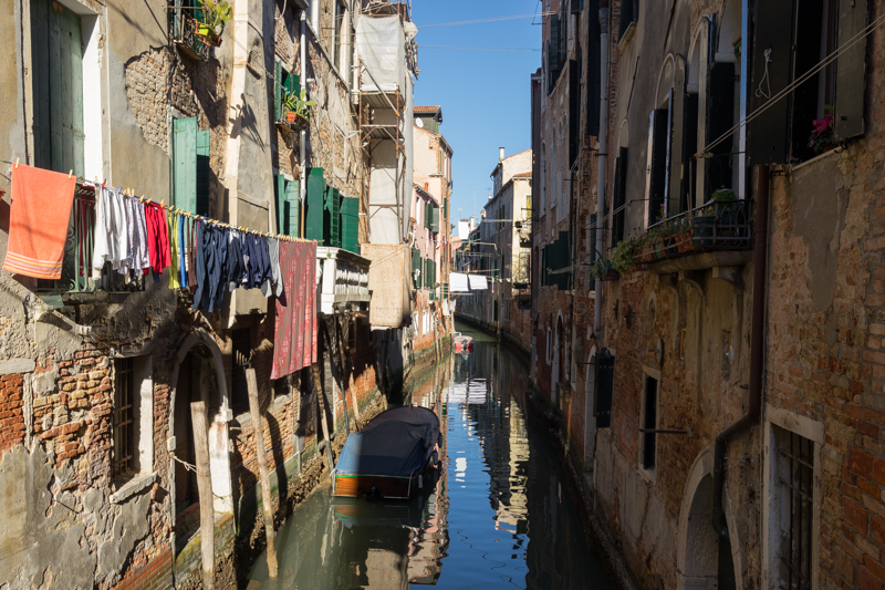 Washing hung out to dry above a canal in Venice